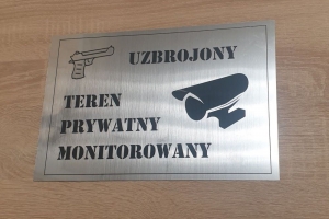 Tabliczka informacyjna - uzbrojony teren prywatny